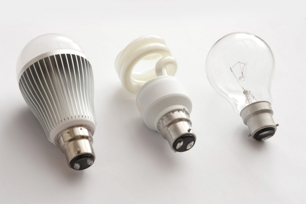 Three generations of light bulbs - LED, fluorescent and incandescent